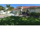 Beautiful single-Gathering home with lush green lawn, mature landscaping, and attached two car garage at 6190 107Th N Ave, Pinellas Park, FL 33782