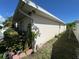 Charming home exterior featuring a well-maintained lawn and meticulously arranged landscaping at 6190 107Th N Ave, Pinellas Park, FL 33782