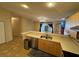 Bright kitchen featuring breakfast bar, stainless steel dishwasher, and open layout to other rooms at 6190 107Th N Ave, Pinellas Park, FL 33782