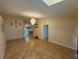 Spacious living room features tile floors, neutral walls, and a modern chandelier at 6190 107Th N Ave, Pinellas Park, FL 33782