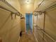 Walk-in closet with shelving and neutral walls at 6190 107Th N Ave, Pinellas Park, FL 33782