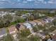 Aerial view of neighborhood featuring mature trees and well-maintained landscaping at 6324 Magnolia Trails Ln, Gibsonton, FL 33534