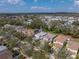 Aerial view of home in neighborhood featuring mature trees and nearby water at 6324 Magnolia Trails Ln, Gibsonton, FL 33534