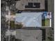 Aerial view of a home with backyard featuring patio furniture and playground at 6324 Magnolia Trails Ln, Gibsonton, FL 33534