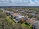 Aerial view of a residential neighborhood, featuring a home with a fenced-in backyard at 6324 Magnolia Trails Ln, Gibsonton, FL 33534