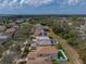 Aerial view of home in neighborhood with mature trees and lawn at 6324 Magnolia Trails Ln, Gibsonton, FL 33534