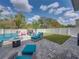 Private backyard with patio, lawn, and play area, offering a perfect blend of relaxation and recreation at 6324 Magnolia Trails Ln, Gibsonton, FL 33534