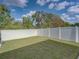 Backyard featuring green lawn and privacy fence at 6324 Magnolia Trails Ln, Gibsonton, FL 33534