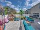 Gathering-friendly backyard with playhouse and trampoline at 6324 Magnolia Trails Ln, Gibsonton, FL 33534