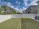 Backyard featuring green lawn and privacy fence at 6324 Magnolia Trails Ln, Gibsonton, FL 33534