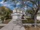 Charming two-story home with two-car garage, long driveway and mature trees at 6324 Magnolia Trails Ln, Gibsonton, FL 33534