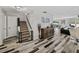 Foyer with wood-look floors and staircase leads to the upper level of the home at 6324 Magnolia Trails Ln, Gibsonton, FL 33534