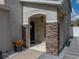 Close up of front porch featuring stone accents and a decorative walkway at 6324 Magnolia Trails Ln, Gibsonton, FL 33534