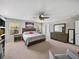 Spacious main bedroom featuring a ceiling fan, carpeted floors, and bright windows at 6324 Magnolia Trails Ln, Gibsonton, FL 33534