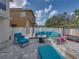 Inviting patio with comfortable seating, fire pit, and playful trampoline, perfect for outdoor enjoyment at 6324 Magnolia Trails Ln, Gibsonton, FL 33534