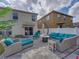 Relaxing outdoor space with cushioned seating, fire pit, and sun umbrella for ultimate comfort at 6324 Magnolia Trails Ln, Gibsonton, FL 33534