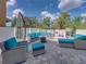 Spacious patio with plush seating, fire pit, and play area, ideal for Gathering fun at 6324 Magnolia Trails Ln, Gibsonton, FL 33534