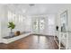 Inviting foyer with decorative glass doors, tiled floor, and stylish lighting at 705 Spanish Main Dr, Apollo Beach, FL 33572