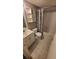 Updated bathroom with patterned tile floor, shower-tub combo and coordinated fixtures at 8609 Mallard Reserve Dr # 103, Tampa, FL 33614