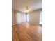 Bright bedroom with wood floors, ceiling fan, and sliding glass doors to the outdoor area at 8609 Mallard Reserve Dr # 103, Tampa, FL 33614