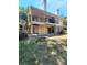 Exterior view of a home with a brick foundation and second story porch at 8609 Mallard Reserve Dr # 103, Tampa, FL 33614
