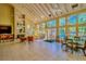 Spacious clubhouse area with fireplace, high ceilings, and large windows overlooking the pool at 8609 Mallard Reserve Dr # 103, Tampa, FL 33614