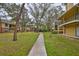 Well-maintained community with landscaped grounds and sidewalks connecting residential buildings at 8609 Mallard Reserve Dr # 103, Tampa, FL 33614