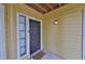 Condo entrance with front door, small window and 'Keys, Phone, Wallet, Glasses' doormat at 8609 Mallard Reserve Dr # 103, Tampa, FL 33614
