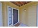 Inviting condo entrance featuring a well-lit porch and stylish door at 8609 Mallard Reserve Dr # 103, Tampa, FL 33614