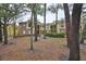 Yellow and brick apartment complex with mature trees and green space at 8609 Mallard Reserve Dr # 103, Tampa, FL 33614