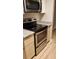 Kitchen featuring stainless steel oven and granite countertops at 8609 Mallard Reserve Dr # 103, Tampa, FL 33614