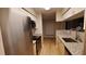 Modern kitchen with stainless steel appliances and granite countertops at 8609 Mallard Reserve Dr # 103, Tampa, FL 33614