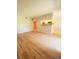 Spacious living room featuring hardwood floors and an open layout with bar into the kitchen at 8609 Mallard Reserve Dr # 103, Tampa, FL 33614