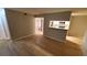 Bright living room with hardwood floors and an open layout into the kitchen at 8609 Mallard Reserve Dr # 103, Tampa, FL 33614