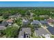 Beautiful home features a screen enclosed pool, and is surrounded by lush trees at 1111 Carriage Park Dr, Valrico, FL 33594
