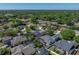 Beautiful home features a screen enclosed pool, and is surrounded by lush trees at 1111 Carriage Park Dr, Valrico, FL 33594