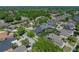 This charming home boasts a screened pool, fenced yard, and mature landscaping at 1111 Carriage Park Dr, Valrico, FL 33594