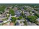 This lovely home features mature landscaping, a sparkling screen enclosed pool, and fenced backyard at 1111 Carriage Park Dr, Valrico, FL 33594