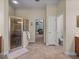 Bathroom with glass shower, views to the main bedroom and dedicated room for the toilet at 1111 Carriage Park Dr, Valrico, FL 33594