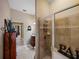 Bathroom featuring a tiled shower with glass door and view of the vanity at 1111 Carriage Park Dr, Valrico, FL 33594