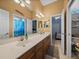 Bathroom featuring a double sink vanity, neutral walls, and a coastal shower curtain at 1111 Carriage Park Dr, Valrico, FL 33594