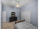 Bedroom showcases a closet, ceiling fan, and dresser with a mirror at 1111 Carriage Park Dr, Valrico, FL 33594