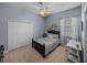 Comfortable bedroom featuring a closet, work desk, and window with blinds at 1111 Carriage Park Dr, Valrico, FL 33594
