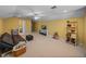 Spacious bonus room with neutral carpet, lots of light, and ample space for entertainment at 1111 Carriage Park Dr, Valrico, FL 33594