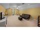 Spacious bonus room with vaulted ceiling, carpet flooring and a neutral color palette at 1111 Carriage Park Dr, Valrico, FL 33594