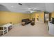 Bonus room with carpet flooring, a leather sofa, a TV, and a vaulted ceiling at 1111 Carriage Park Dr, Valrico, FL 33594