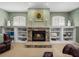 Charming fireplace with stone surround and built-in shelving offering both warmth and display space at 1111 Carriage Park Dr, Valrico, FL 33594