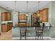 Breakfast bar in kitchen with granite countertops and seating for casual dining at 1111 Carriage Park Dr, Valrico, FL 33594