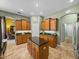 Open kitchen with island and plenty of countertop space perfect for entertainment at 1111 Carriage Park Dr, Valrico, FL 33594