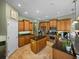 Spacious kitchen with stainless steel appliances, granite countertops, and a center island at 1111 Carriage Park Dr, Valrico, FL 33594
